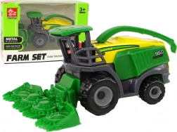 Zelený malý poľnohospodársky kombajn – hračka