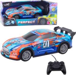 RC pretekárske auto so svietiacou karosériou, oranžovo‑tyrkysové