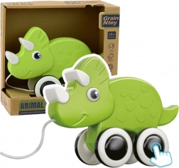 Zelený dinosaurus na ťahanie s píšťalkou