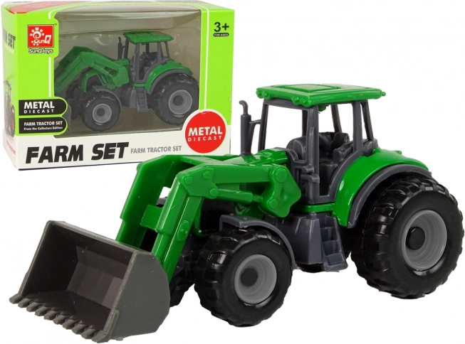 Malý zelený traktor s nakladačom
