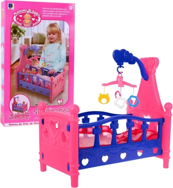 Postieľka pre bábiky s kolotočom a lôžkovinami, 3+