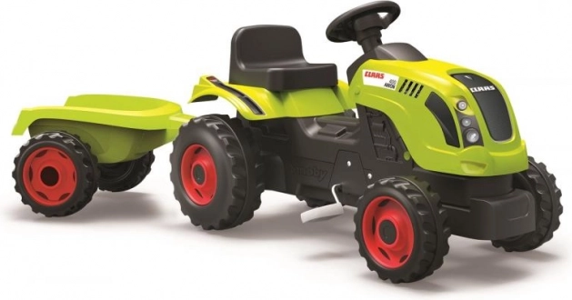 Šliapací traktor CLAAS so zeleným vozíkom