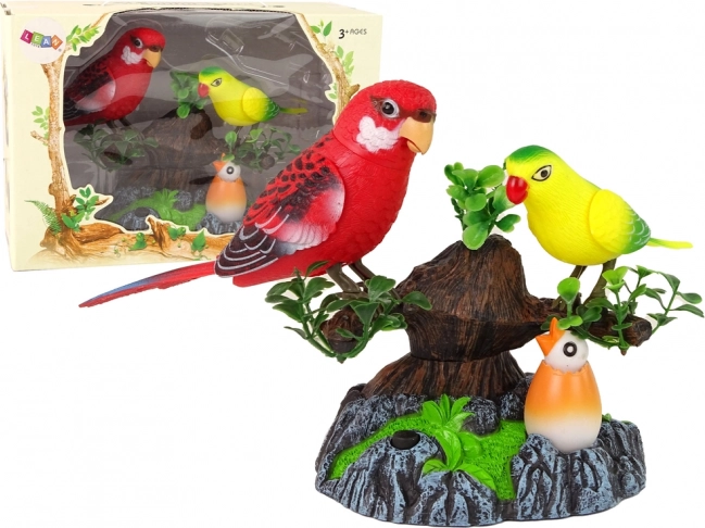 Spievajúce pohyblivé papagáje na farebnom strome