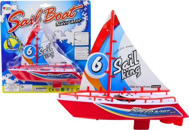 Červená plávajúca loďka na batérie