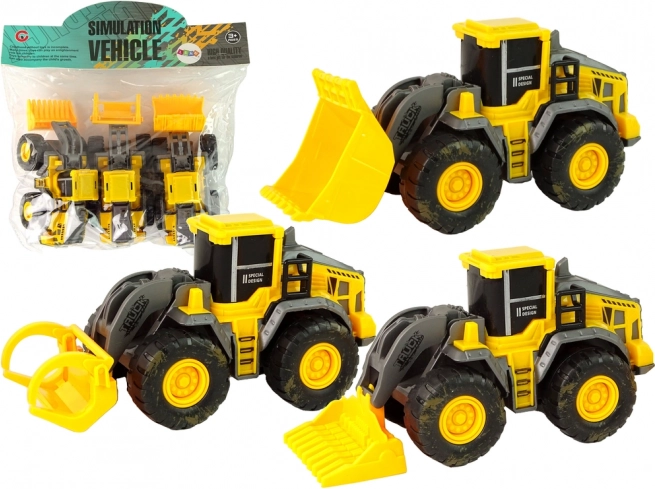 Sada troch žltých stavebných vozidiel