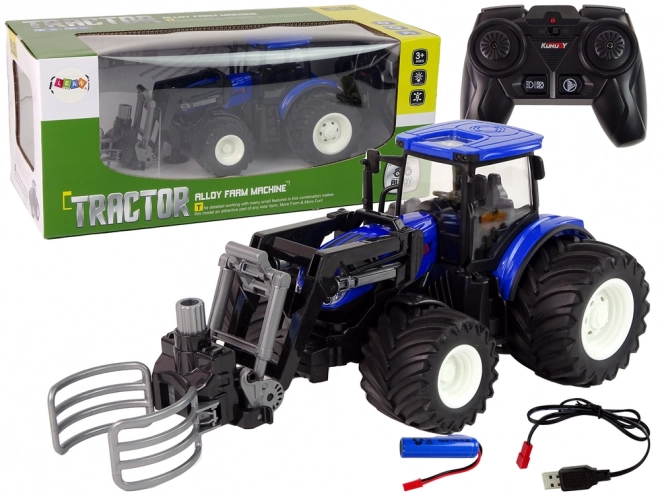 Traktor na diaľkové ovládanie s uchopovačom