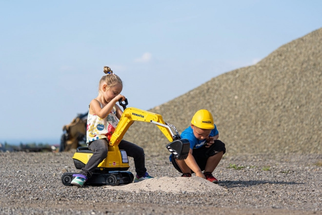 Detská otáčajúca sa bager Komatsu s helmou