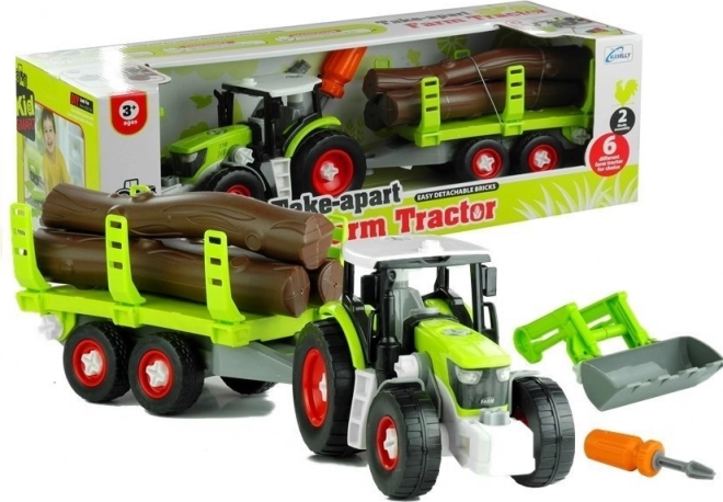 Skladací traktor s vlekom na drevo
