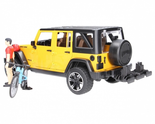 Jeep Wrangler Rubicon Unlimited s horským bicyklom a cyklistom