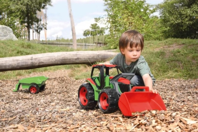 Traktor s lopatou a vozíkom