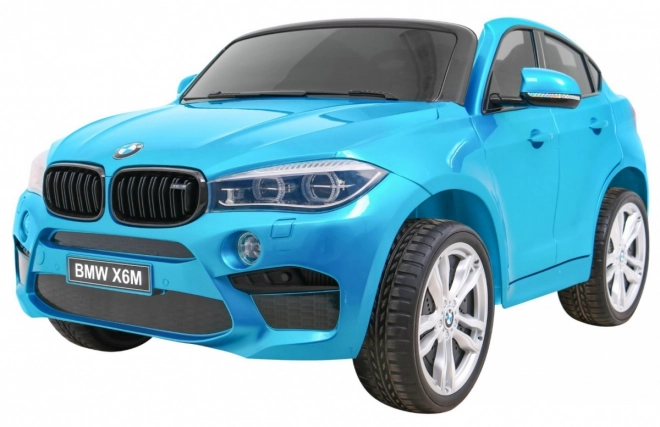 BMW X6M XXL pro 2 deti Modrá farba + Pilot + Eco koža + Bezpečnostné pásy + Pomalý štart + MP3 + LED