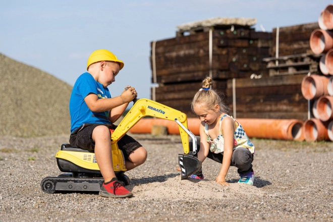 Detská otáčajúca sa bager Komatsu s helmou
