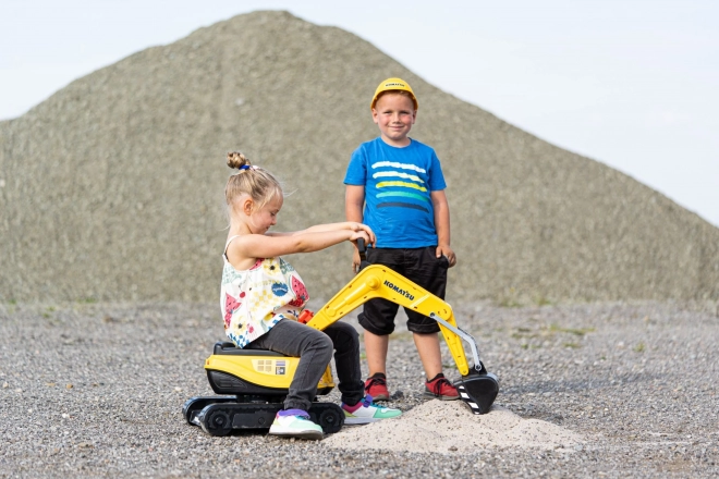 Detská otáčajúca sa bager Komatsu s helmou