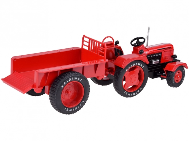 Červený kovový traktor s prívesom 1:18