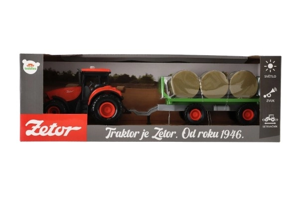 Traktor Zetor s vlekom a balíkmi