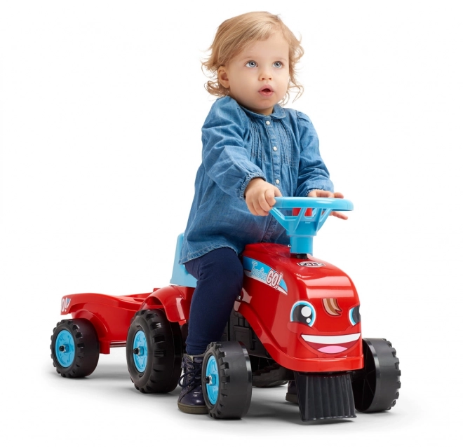 Odstrkovadlo - traktor Go Farm červené s volantom a vlečkou