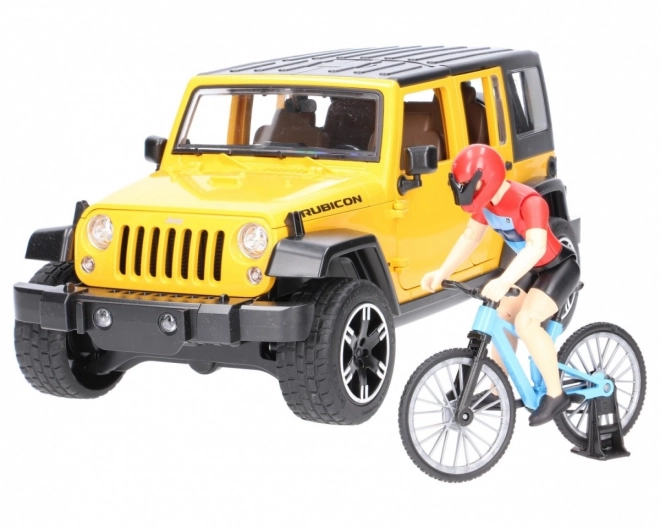 Jeep Wrangler Rubicon Unlimited s horským bicyklom a cyklistom