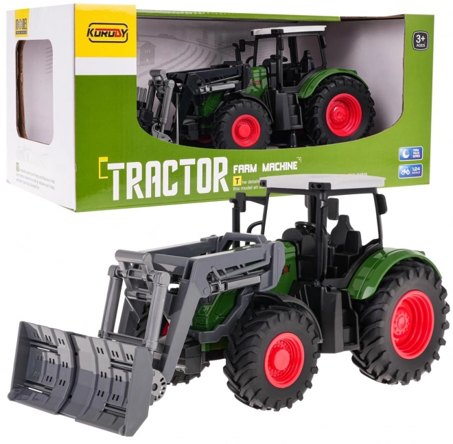 Zelený traktor so sklápacou radlicou