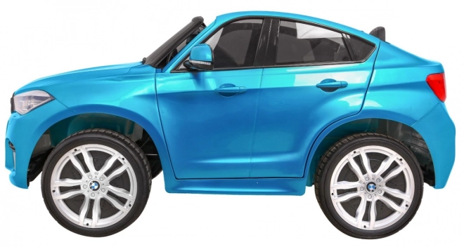 BMW X6M XXL pro 2 deti Modrá farba + Pilot + Eco koža + Bezpečnostné pásy + Pomalý štart + MP3 + LED