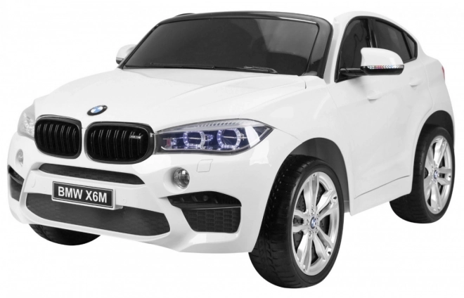 BMW X6M XXL pro 2 deti Biela + diaľkové ovládanie + eko koža + bezpečnostné pásy + pomalý rozjazd + MP3 USB + LED