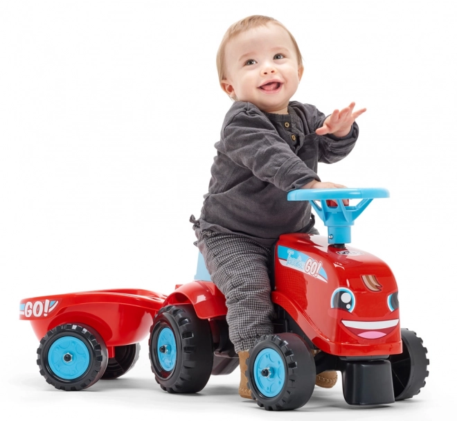 Odstrkovadlo - traktor Go Farm červené s volantom a vlečkou