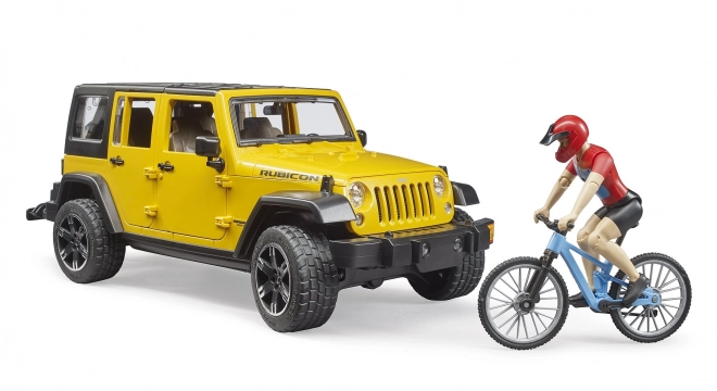 Jeep Wrangler Rubicon Unlimited s horským bicyklom a cyklistom