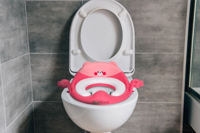 Detská WC sedačka s úchytkami a mäkkým vankúšikom, ružová