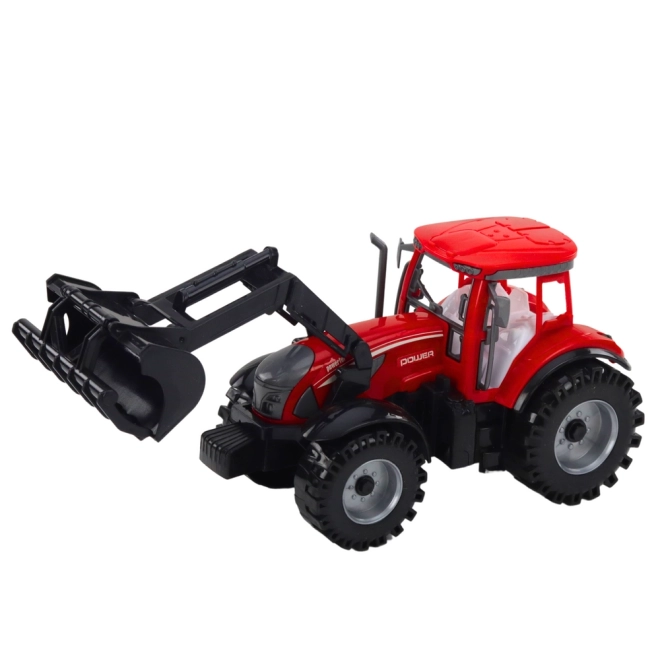 Červený traktor s nakladačom a balíkovačom