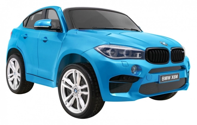 BMW X6M XXL pro 2 deti Modrá farba + Pilot + Eco koža + Bezpečnostné pásy + Pomalý štart + MP3 + LED
