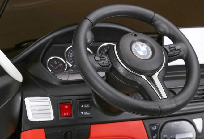 BMW X6M XXL pro 2 deti Biela + diaľkové ovládanie + eko koža + bezpečnostné pásy + pomalý rozjazd + MP3 USB + LED