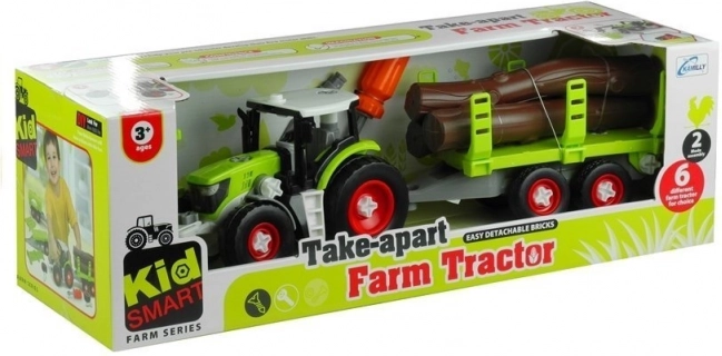 Skladací traktor s vlekom na drevo