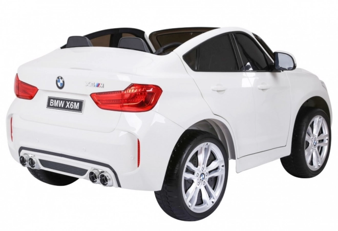 BMW X6M XXL pro 2 deti Biela + diaľkové ovládanie + eko koža + bezpečnostné pásy + pomalý rozjazd + MP3 USB + LED