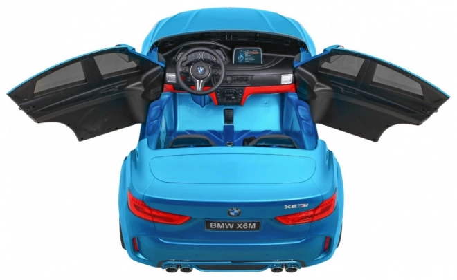 BMW X6M XXL pro 2 deti Modrá farba + Pilot + Eco koža + Bezpečnostné pásy + Pomalý štart + MP3 + LED