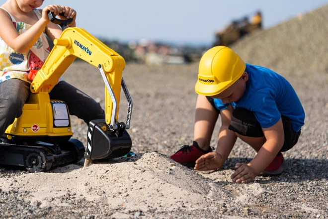 Detská otáčajúca sa bager Komatsu s helmou