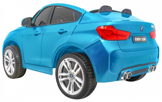 BMW X6M XXL pro 2 deti Modrá farba + Pilot + Eco koža + Bezpečnostné pásy + Pomalý štart + MP3 + LED