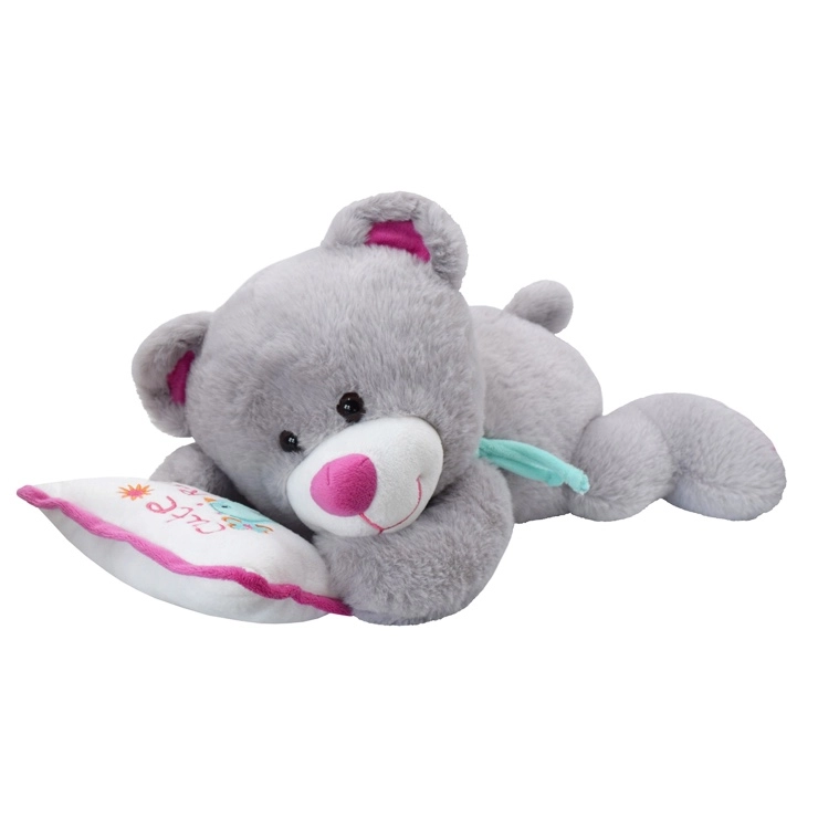 Sivý plyšový medvedík na vankúšiku