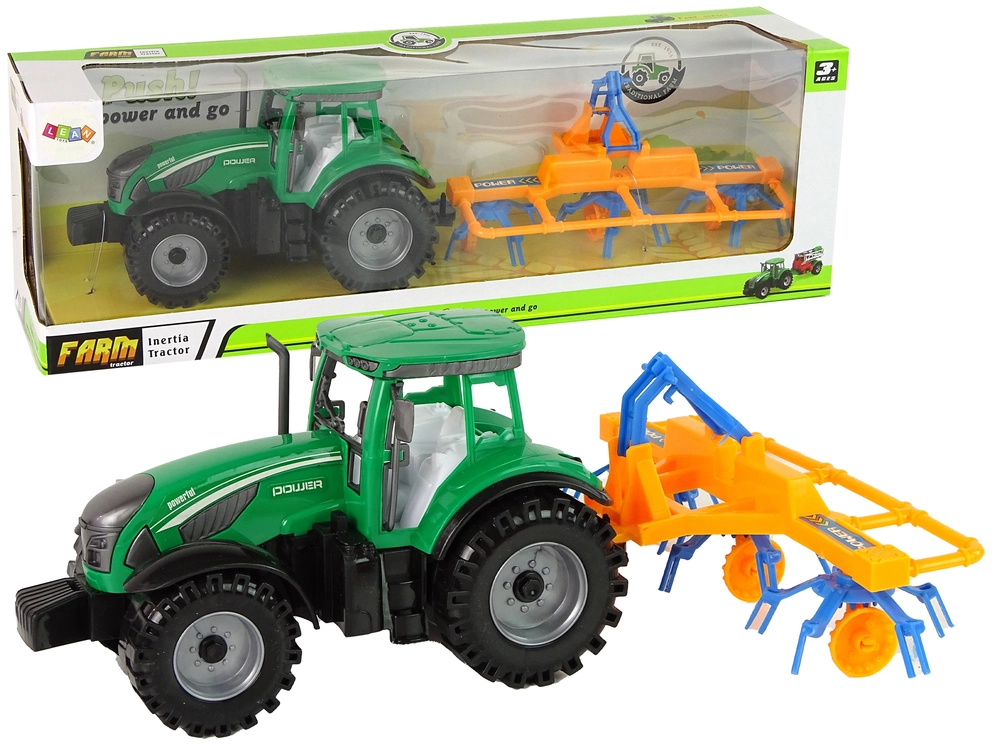 E-shop Lean Toys Zelený traktor s hrabľami na seno trecí pohon