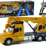 Diaľkovo ovládaný žltý nákladný auto s žeriavom a zvukmi